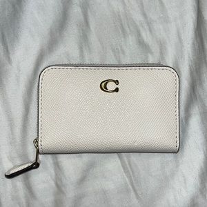 Small white Coach wallet